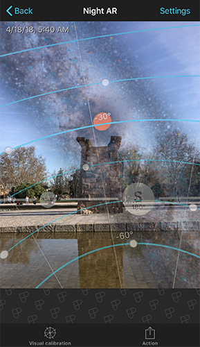 Night AR view showing the Milky Way band overlaid on a real daytime scene with a monument