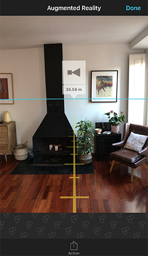 Augmented reality view showing a measurement line and ruler ticks overlaid on a living room, marking a distance of 35.56 meters